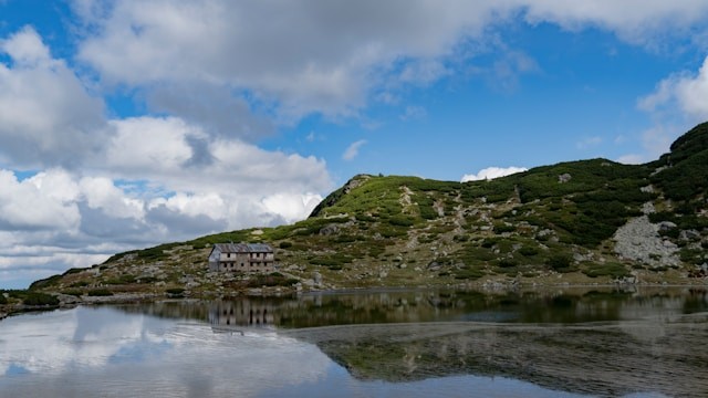 a house on a hill by the water a house on a hill by the water